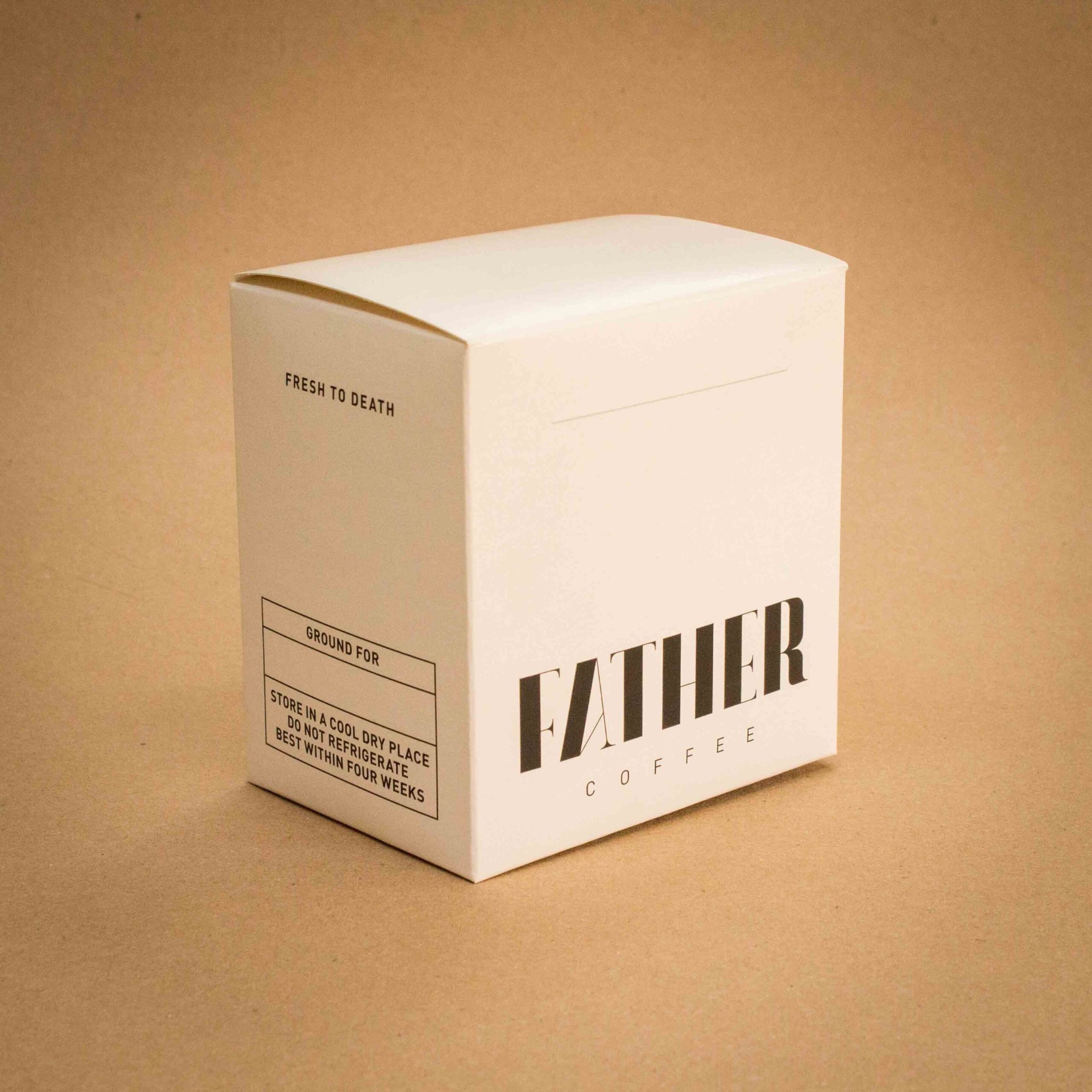 Father Coffee minimalist white folding carton with black display typography Father Coffee minimalist white folding carton with black display typography