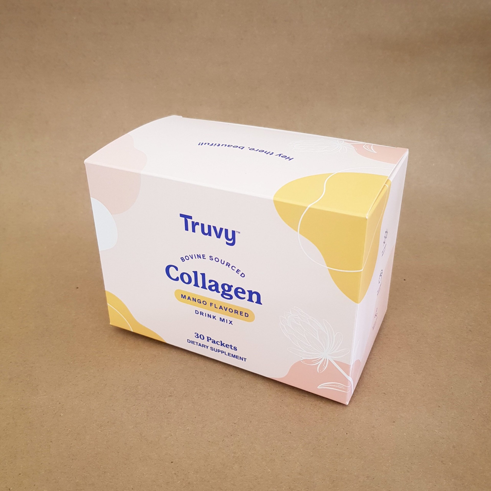 Truvy bovine sourced mango collagen drink mix folding carton in pastel pink and yellow with protea illustration Truvy bovine sourced mango collagen drink mix folding carton in pastel pink and yellow with protea illustration