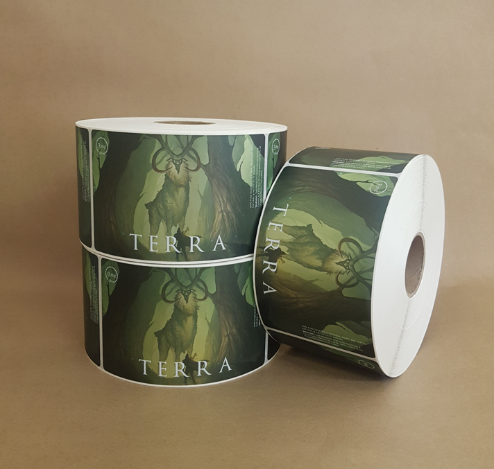 Terra wine label rolls featuring illustrated stag artwork on green background Terra wine label rolls featuring illustrated stag artwork on green background