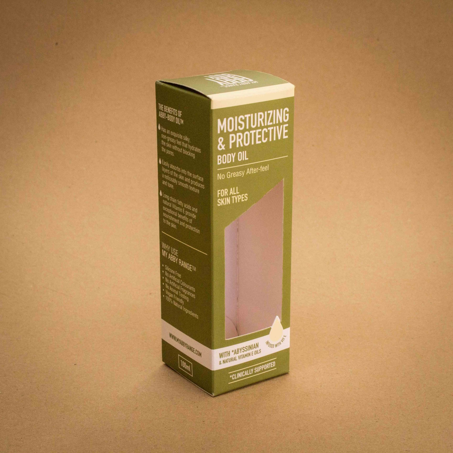 My Abby Range moisturizing and protective body oil folding carton in olive green with window patch My Abby Range moisturizing and protective body oil folding carton in olive green with window patch