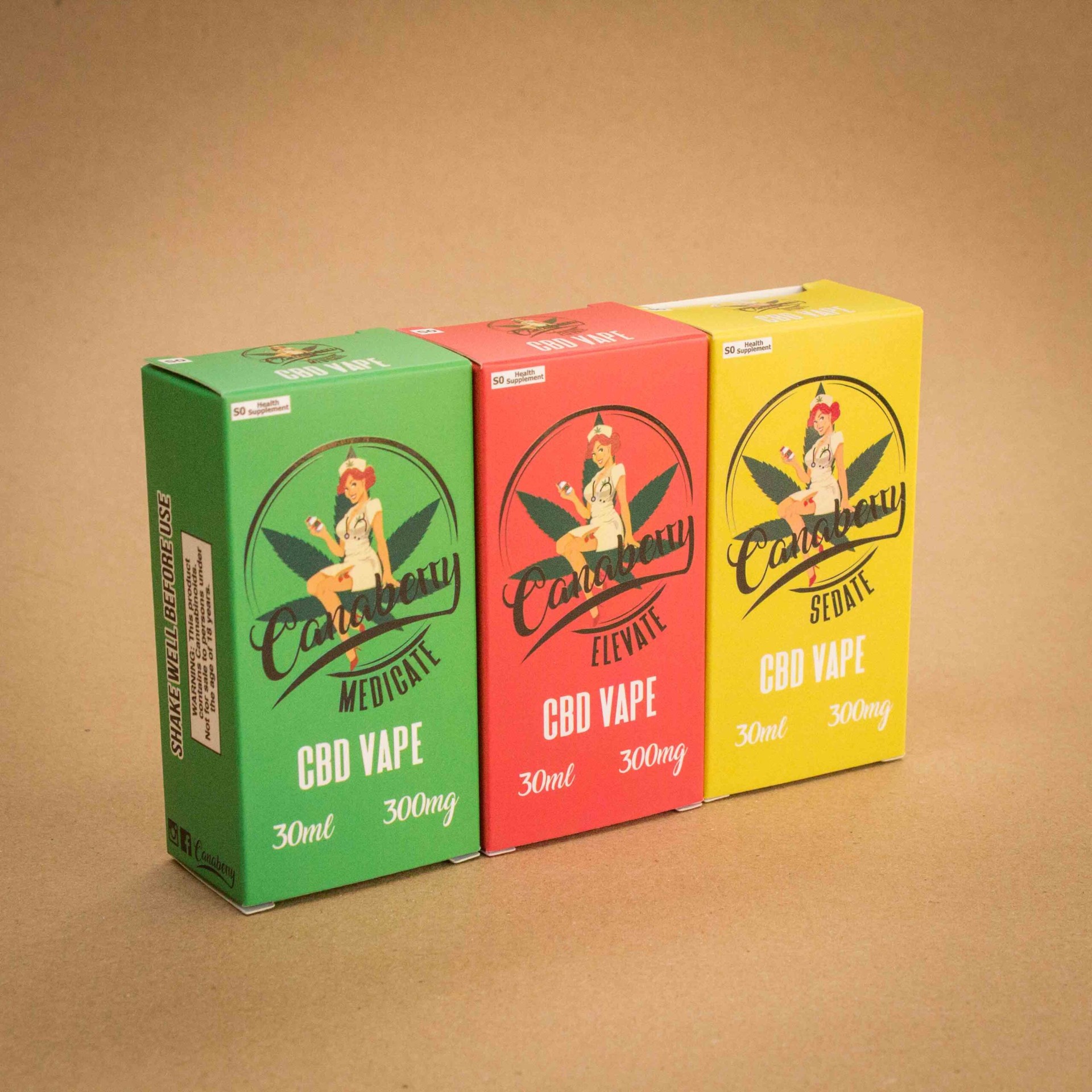 Canaberry CBD Vape folding cartons in green Medicate, red Elevate and yellow Sedate with pin-up nurse logo Canaberry CBD Vape folding cartons in green Medicate, red Elevate and yellow Sedate with pin-up nurse logo